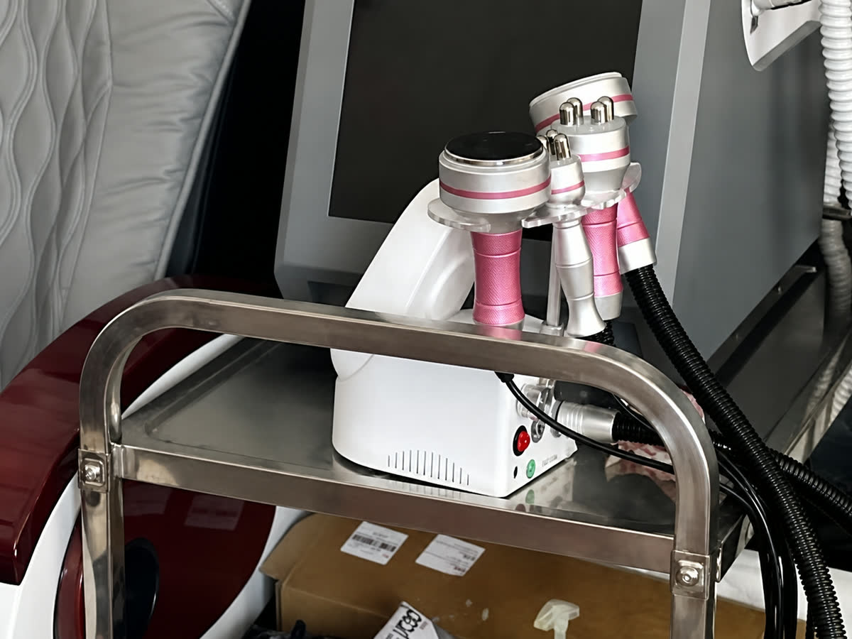 Radiofrequency and cavitation handpieces on their stand in the studio